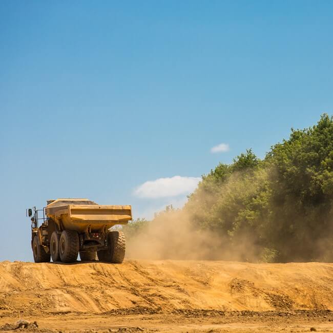 Construction equipment developing land